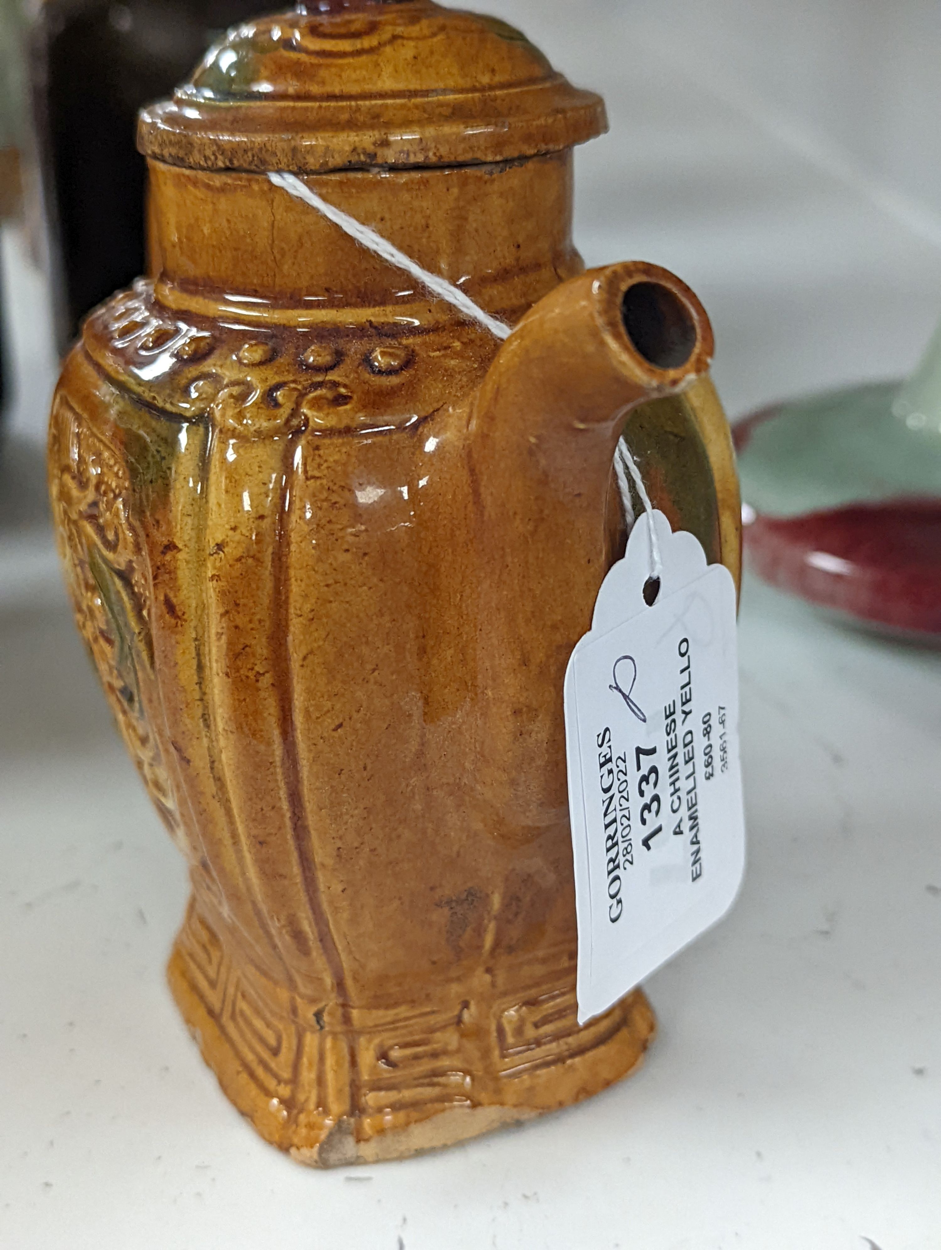 A Chinese enamelled yellow-ground jar and cover, a pottery teapot and cover and a flambe vase, latter 13cm